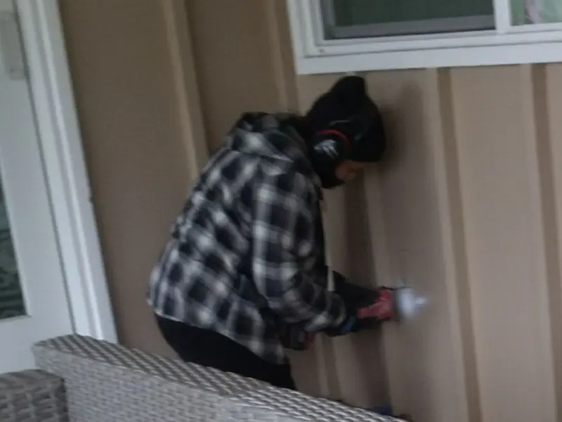 Professional electrician installing an exterior outlet in Cumberland